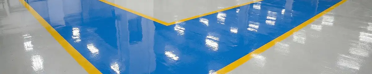 A factory floor professionally covered and marked with epoxy flooring in Fargo, ND