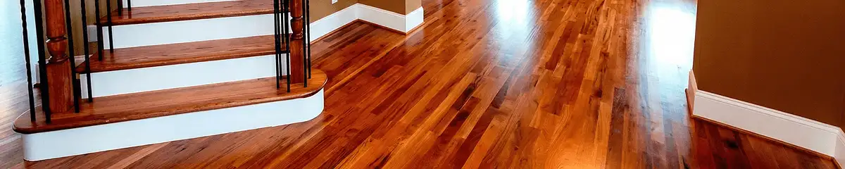 Base floor of a staircase with professionally restored wood flooring in Fargo ND