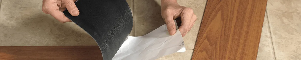 A professional installing vinyl flooring in Fargo, ND