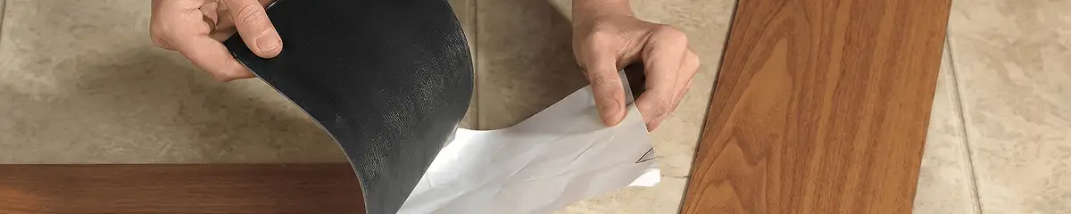 A professional installing vinyl flooring in Fargo, ND