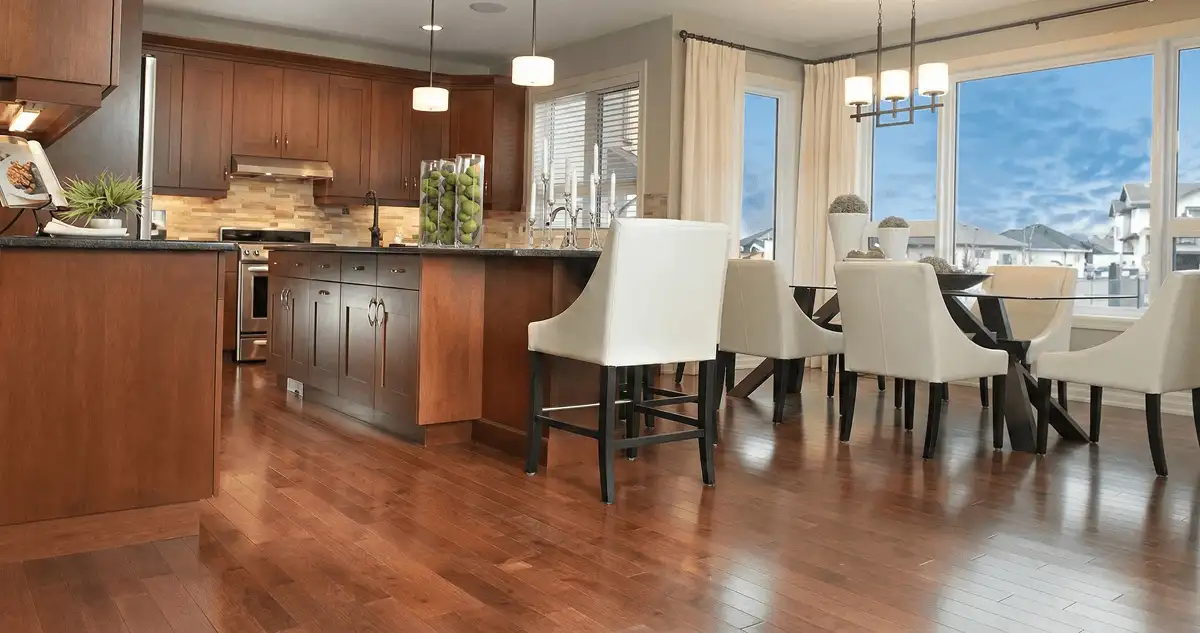 A modern kitchen with professionally installed wood flooring in Fargo, ND